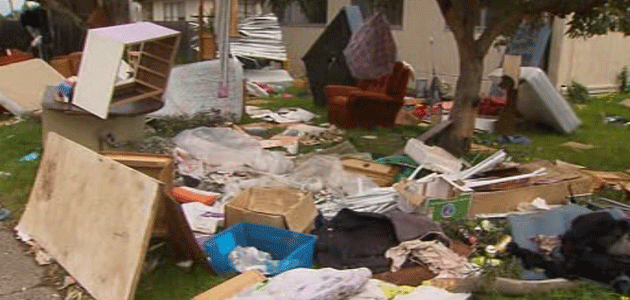 All manner of items and rubbish has been strewn across the front yard of this Laverton home. Photo: 7News