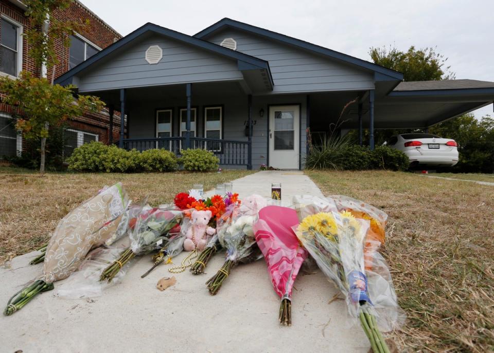 Flowers lie on the sidewalk in front of the house in Fort Worth, Texas, where a white Fort Worth police officer Aaron Dean shot and killed Atatiana Jefferson, a black woman, through a back window of her home ((AP Photo/David Kent, File))