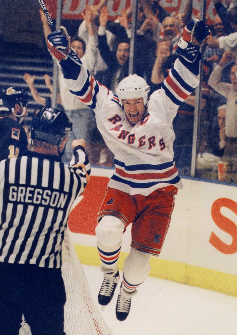 New York Rangers Mark Messier celebrates  against the Vancouver Canucks in Game 7 of the Stanley Cup Finals in 1994.