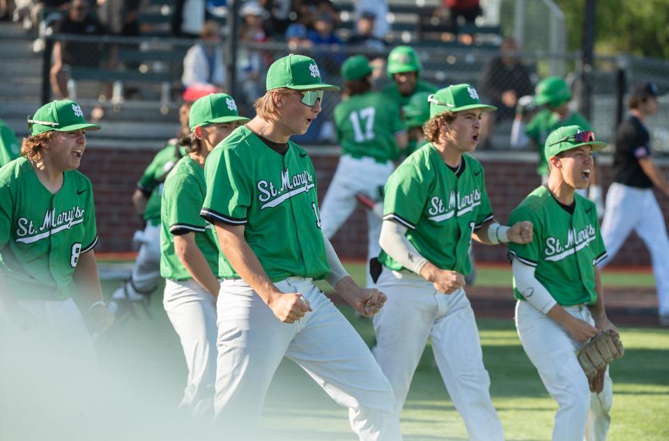 The St.Mary's dugout explodes with cheering after the go-ahead run comes in during a Sac-Joaquin Section playoff game against Folsom at St. Mary's in Stockton on Thursday, May 11, 2023.  St. Mary's won 6-1.