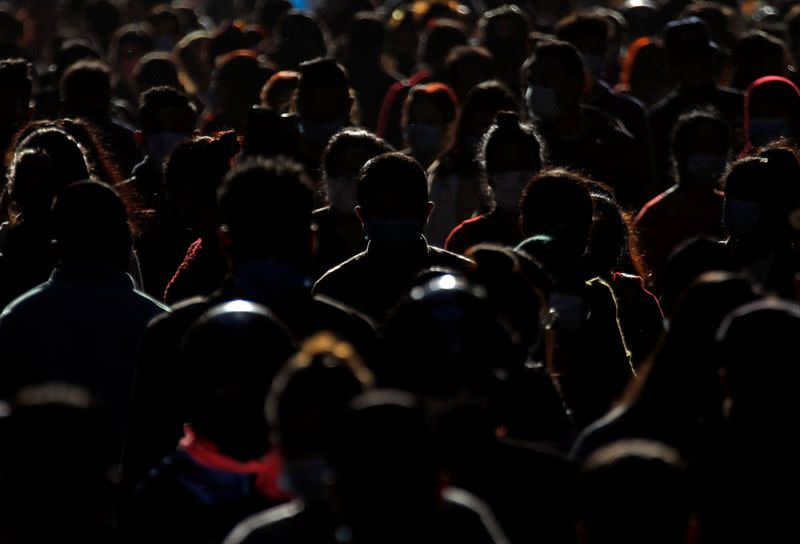 FILE PHOTO: Shoppers crowd a market at Ashon, during Tihar festival, also called Diwali, in Kathmandu