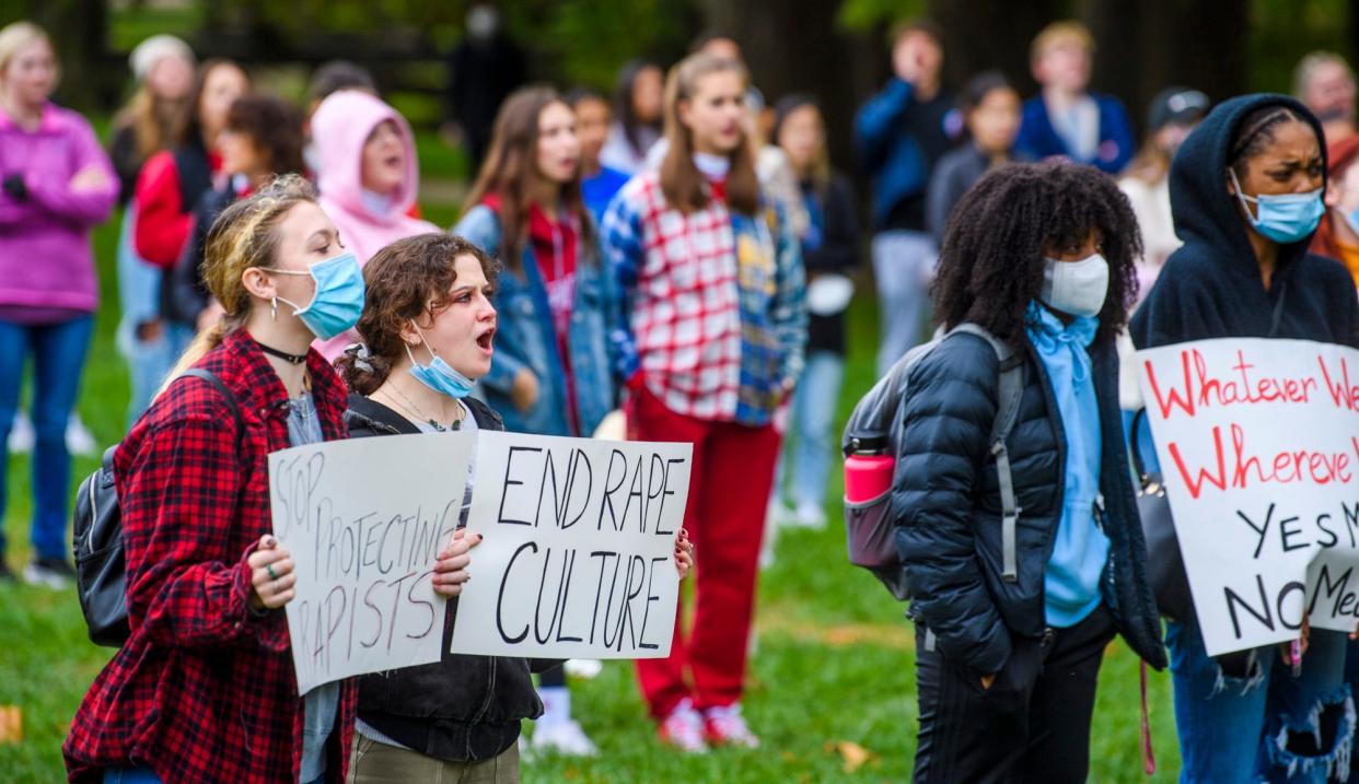 Attendees do a call and response Oct. 22, 2021, during the Hoosiers Against Sexual Assault demonstration in Indiana University's Dunn Meadow.