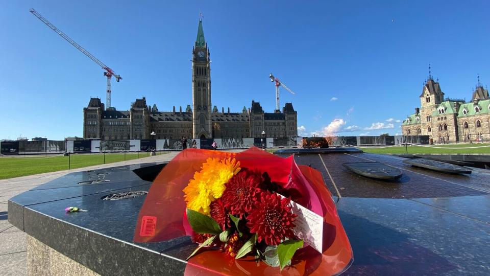 A bouquet of flowers at the Centennial Flame on Parliament Hill, not long after the death of Queen Elizabeth II was announced on Thursday.