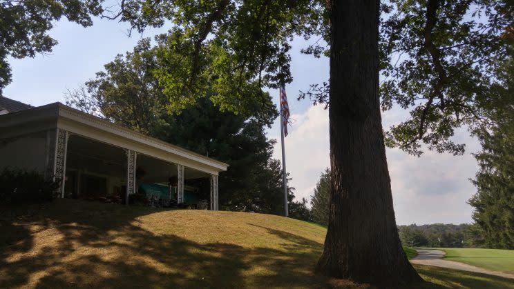 The flag flies at half-staff outside the Latrobe Country Club clubhouse. (Getty Images)