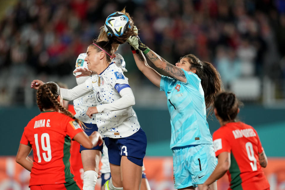 AUCKLAND, NEW ZEALAND - AUGUST 01: Inês Pereira #1 of Portugal attempts to clear a ball as Alex Morgan #13 of the United States goes for the header during the second half of the FIFA Women's World Cup Australia & New Zealand 2023 Group E match between Portugal and USA at Eden Park on August 01, 2023 in Auckland, New Zealand. (Photo by Brad Smith/USSF/Getty Images)