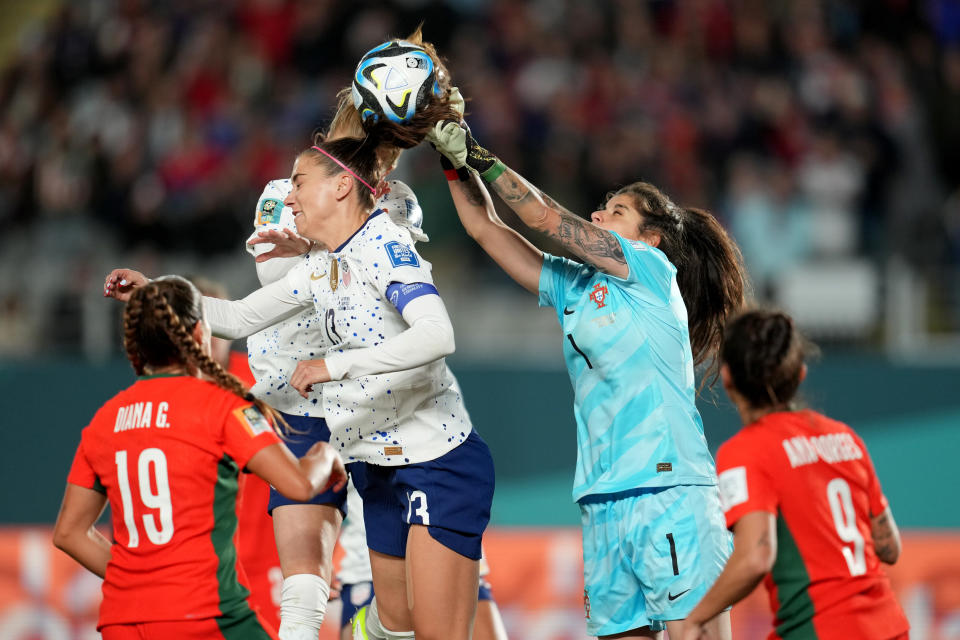 AUCKLAND, NEW ZEALAND - AUGUST 01: V Pereira No. 1 of Portugal tries to clear the ball as Alex Morgan No. 13 of the USA scores a header during the second half of the FIFA Women's World Cup Australia vs New Zealand 2023 Group E match between Portugal and the USA in Eden Park on August 1, 2023 in Auckland, New Zealand.  (Photo by Brad Smith/USSF/Getty Images)