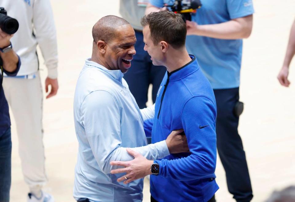 North Carolina head coach Hubert Davis greets Duke head coach Jon Scheyer before Duke’s game against UNC at Cameron Indoor Stadium in Durham, N.C., Saturday, Feb. 4, 2023.