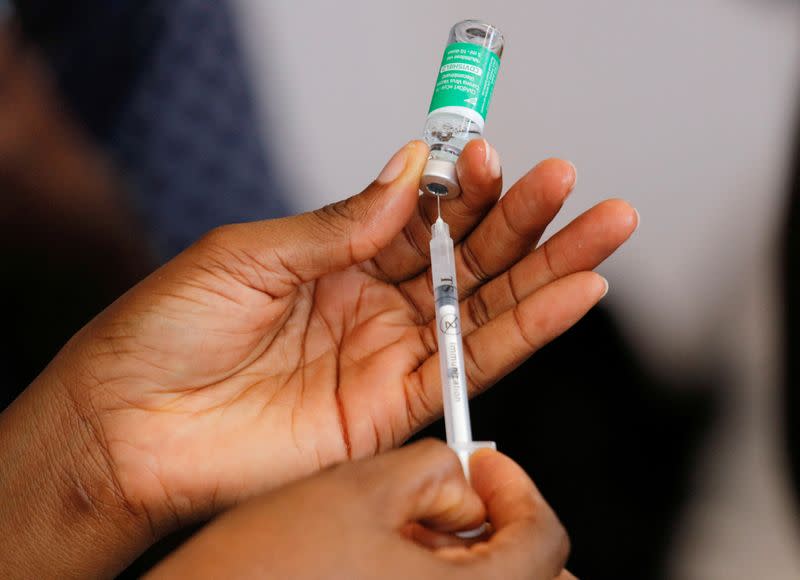 FILE PHOTO: A nurse prepares a dose of the of coronavirus disease (COVID-19) vaccine during the vaccination campaign at the Ridge Hospital in Accra, Ghana, March 2, 2021