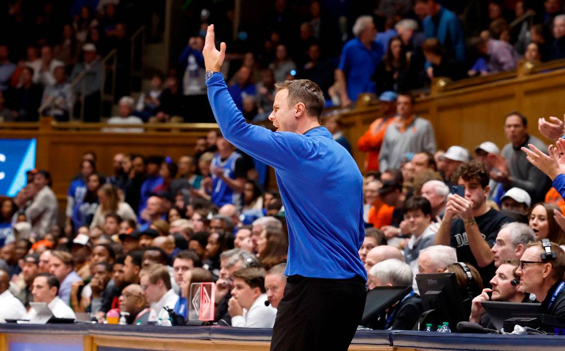 Duke head coach Jon Scheyer encourages the crowd to stand up and cheer during the second half of Duke’s 86-66 victory over Syracuse at Cameron Indoor Stadium in Durham, N.C., Tuesday, Jan. 2, 2024.