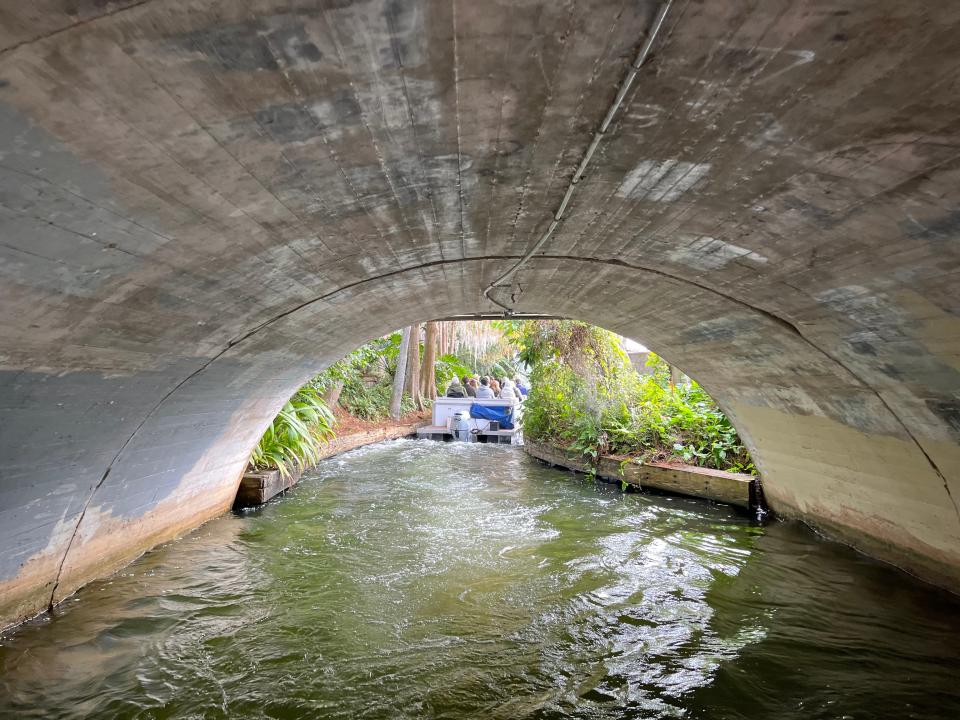 view underneath a bridge along a canal in a lake in winter park Florida