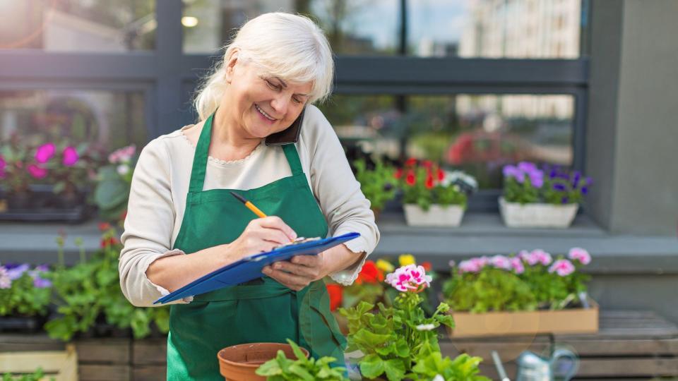 Woman working in florist shop.