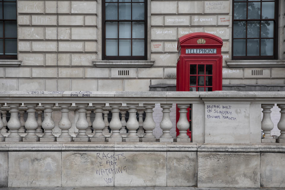 LONDON, ENGLAND - JUNE 08: Graffiti that reads 'Britain built on Slavery' on Great George Street on June 08, 2020 in London, England. As the British government further relaxes Covid-19 lockdown measures in England, this week sees preparations being made to open non-essential stores and Transport for London handing out face masks to commuters. International travelers arriving in the UK will face a 14-day quarantine period. (Photo by Dan Kitwood/Getty Images)