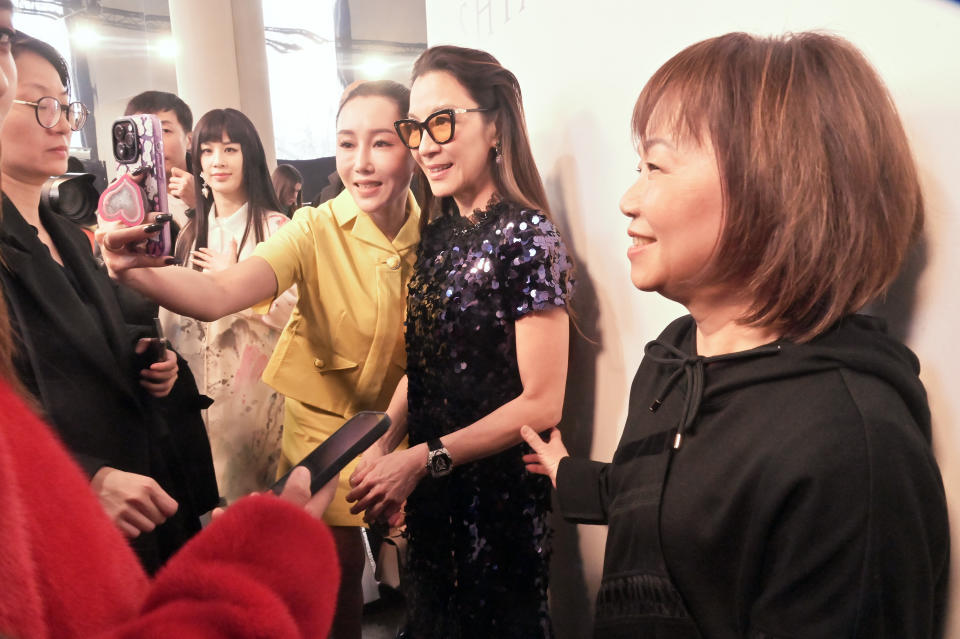 Michelle Yeoh and designer Wang Chen Tsai-Hsia of Shiatzy Chen at the brand's fall 2023 show. 