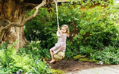 Princess Charlotte tries out the swing - Credit: Matt Porteous