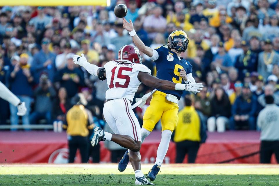 Michigan quarterback J.J. McCarthy makes a pass against Alabama linebacker Dallas Turner during the first half of the Rose Bowl in Pasadena, California, on Monday, Jan. 1, 2024.