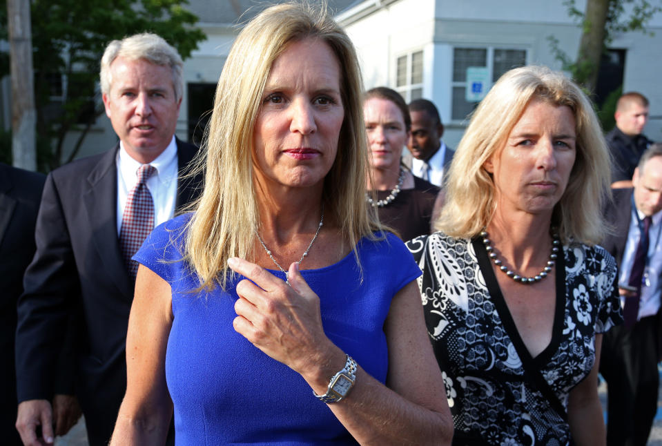FILE- In this July 17, 2012 file photo, Kerry Kennedy, ex-wife of New York Gov. Andrew Cuomo, center, is flanked by her brother Christopher Kennedy, left, and sister Rory Kennedy as she walks from the North Castle Justice Court in Armonk, N.Y. Jurors will hear Monday, Feb. 24, 2014, about Kerry's morning routine and daily medications as they consider whether she's guilty of drugged driving. The case against Kennedy, daughter of the late Sen. Robert Kennedy, goes to trial Monday morning in suburban White Plains. In 2012, Kennedy was arrested after her car hit a tractor-trailer on an interstate highway near her home in the New York City suburbs. (AP Photo/Craig Ruttle, File)