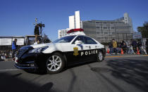 A police car is diven away from Tokyo Detention Center, where former Nissan chairman Carlos Ghosn and another former executive Greg Kelly, are being detained, in Tokyo Friday, Dec. 21, 2018. Japanese prosecutors added a new allegation of breach of trust against Ghosn on Friday, dashing his hopes for posting bail. (AP Photo/Eugene Hoshiko)