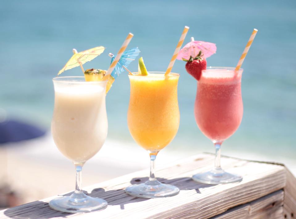 Guests at Eau Palm Beach Resort's Breeze Ocean Kitchen favor a frozen piña colada, from left, or frozen mango and strawberry daiquiris.