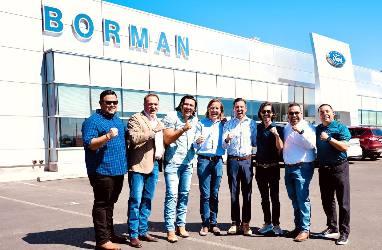 Ronnie Lowenfield (fourth from left), his brothers Justin and Luke (next to him), and key managers for Casa Auto Group outside the Ford dealership at the Borman Autoplex Sept. 20 after Casa acquired the 20-acre new-car complex in Las Cruces.