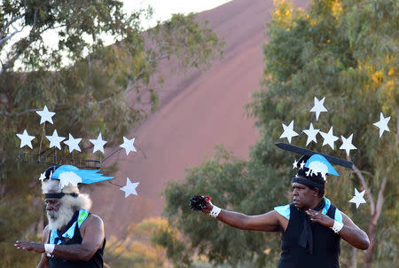 Performers from Thursday Island located in the Torres Strait dance during the opening ceremony for the National Indigenous Constitutional Convention, a three day conference designed to come up with a consensus response on how indigenous people should be recognised in Australia's constitution, at Mutitjulu near Uluru in central Australia, May 23, 2017. AAP/Lucy Hughes Jones/via REUTERS