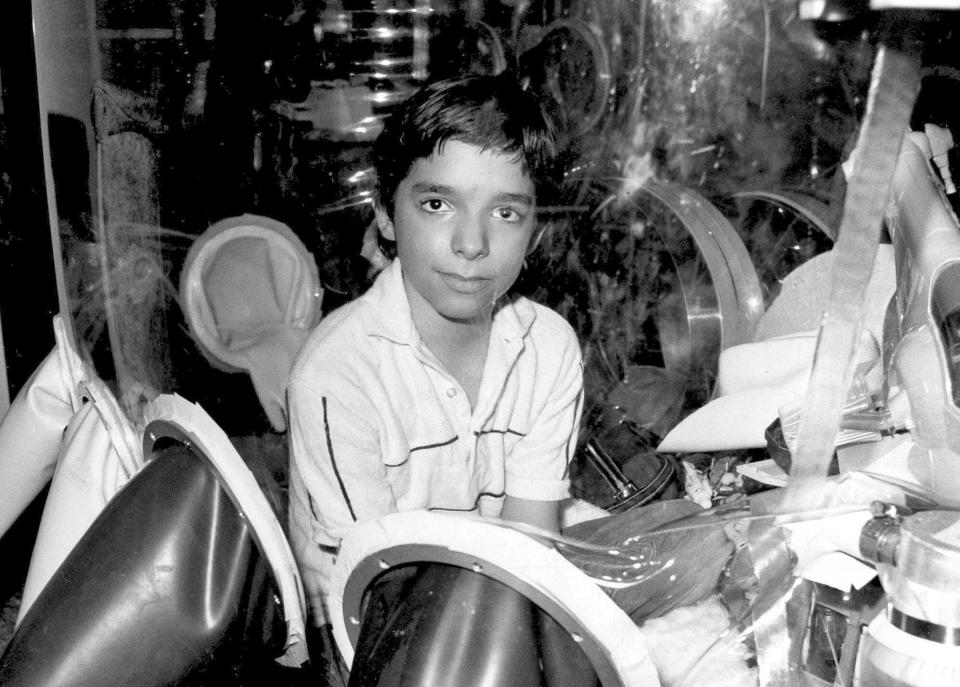 FILE - This Sept. 11, 1982, file photo shows David Vetter, born with an inherited disorder which leaves him no natural immunities against disease, in his protective enclosure in Texas. In 1984, Vetter died from complications from an experimental bone marrow transplant, thought to be his only chance at survival outside the "bubble." (AP Photo/File)