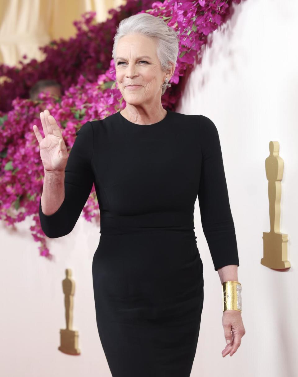 Jamie Lee Curtis wears a long-sleeve black dress.