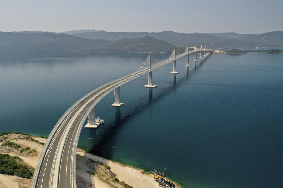 An aerial view of the newly built Peljesac Bridge in Komarna, southern Croatia, Tuesday, July 26, 2022. Croatia is marking the opening of a key and long-awaited bridge connecting two parts of the country's Adriatic Sea coastline while bypassing a small part of Bosnia's territory. (AP Photo)