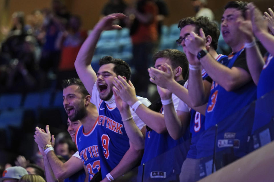 New York Knicks fans cheer before Game 1 of an NBA basketball first-round playoff series against the Atlanta Hawks, Sunday, May 23, 2021, in New York. (AP Photo/Seth Wenig, Pool)