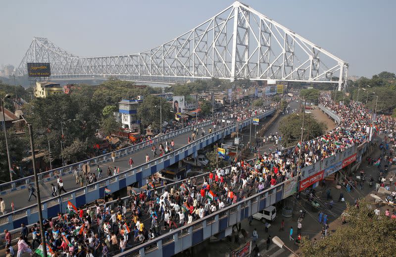 Supporters of Mamata Banerjee, the Chief Minister of West Bengal, attend a protest march against the National Register of Citizens and a new citizenship law, in Kolkata