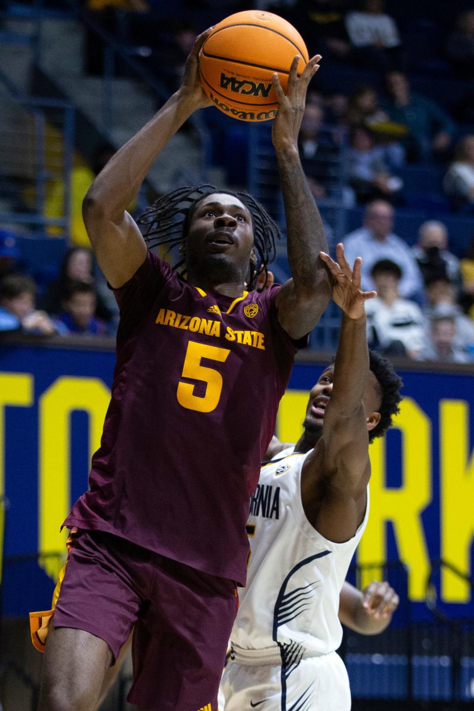 Arizona State guard Jamiya Neal (5) drives to the basket ahead of California guard Jalen Cone (right) during the first half of an NCAA college basketball game on Dec. 31, 2023, in Berkeley, California.
