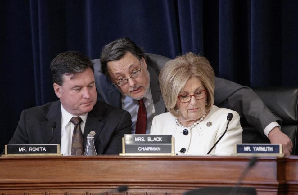 House Budget Committee Chair Diane Black, R-Tenn., right, joined at left by Rep. Todd Rokita, R-Ind., and panel staff member Jim Bates, center, works on the Republican health care bill, on Capitol Hill in Washington, Thursday, March, 16, 2017. (AP Photo/J. Scott Applewhite)