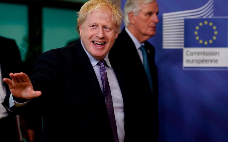 Johnson in Brussels last year. The Prime Minister has been asked to step in and help to accelerate talks - GETTY IMAGES