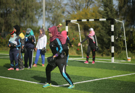 Palestinian women take part in a baseball training session in Khan Younis in the southern Gaza Strip March 19, 2017. REUTERS/Mohammed Salem