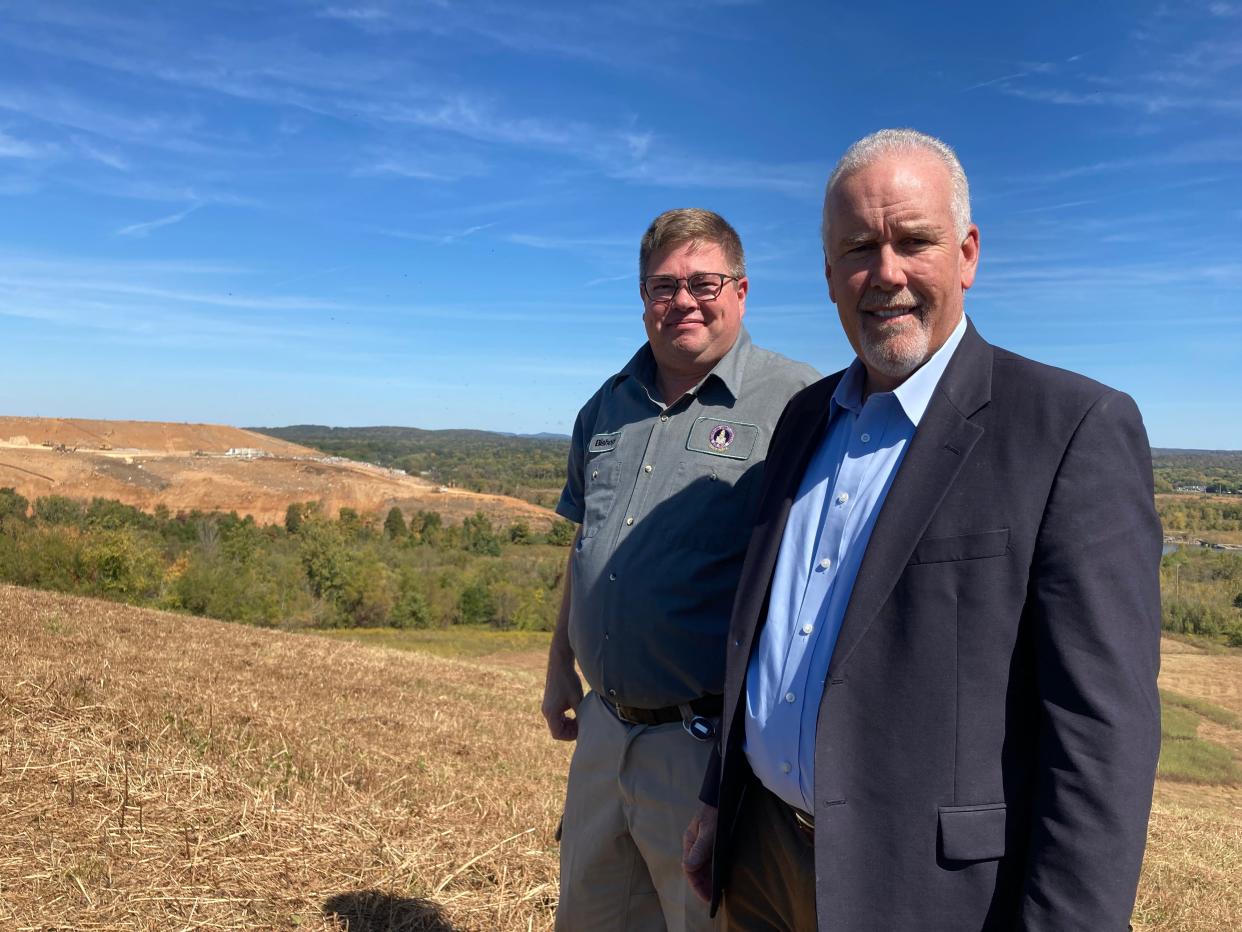 Rutherford County Mayor Joe Carr, right, and Bishop Wagener, the county's solid waste director, pose on the government's land with a view behind them of trash dumping operation at the adjacent Middle Point Landfill, which is owned by Phoenix-based Republic Services.