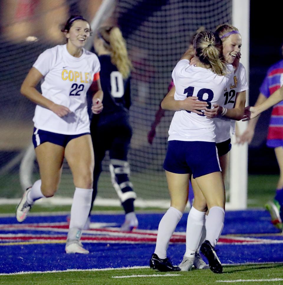 Copley's Emily Kerekes celebrates her first half goal against Revere with Emma Niemczura on Tuesday, Sept. 26, 2022 in Bath Township.