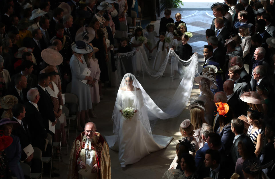 WINDSOR, UNITED KINGDOM - MAY 19:  Meghan Markle and her bridal party walk down the aisle of St George's Chapel at Windsor Castle for the wedding to Prince Harry on May 19, 2018 in Windsor, England. (Photo by Danny Lawson - WPA Pool/Getty Images)