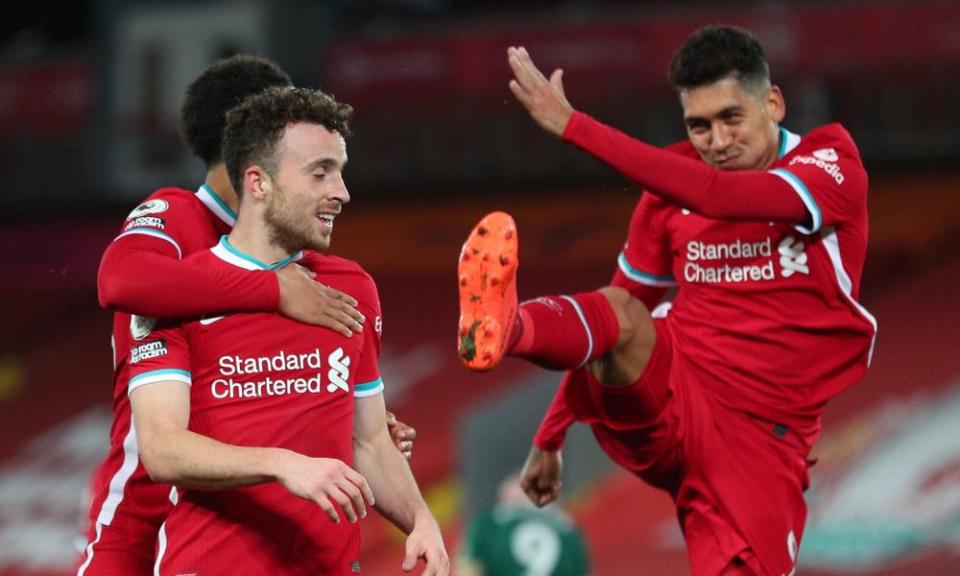 Diogo Jota celebrates with Roberto Firmino and Trent Alexander-Arnold after scoring Liverpool’s winner.