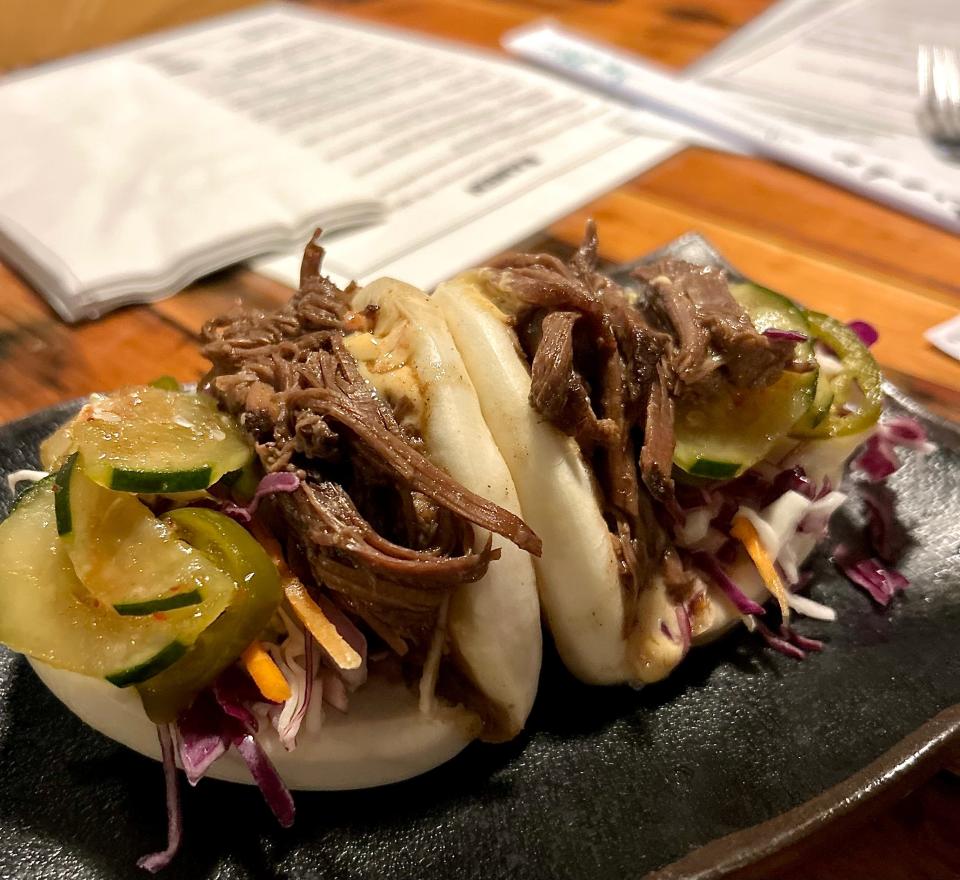 Easy Tyger's Beef Brisket Bao Buns are stuffed with tender char siu beef brisket, cucumber kimchi, daikon and spicy mayo.