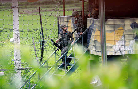 South Korean soldiers stand guard at a guard post near the demilitarised zone separating the two Koreas in Paju, South Korea, August 10, 2017. REUTERS/Kim Hong-Ji