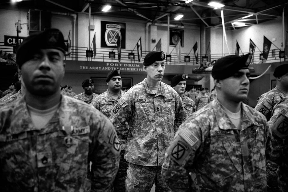 After returning home from a 12-month deployment in Afghanistan, U.S. soldiers from the 10th Mountain Division receive awards for valor at the MaGrath Gym in Fort Drum, N.Y. January 2010.