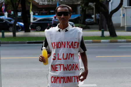 A member of Khon Kaen Slum Network community group attends a rally outside the United Nations building in Bangkok, Thailand, October 3, 2016. REUTERS/Chaiwat Subprasom