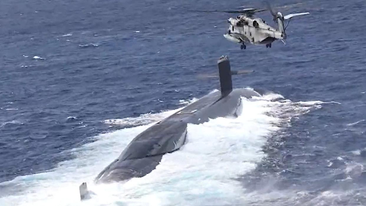 No More Silent Service As Marine CH-53s Resupply Ballistic Submarine In Pacific photo