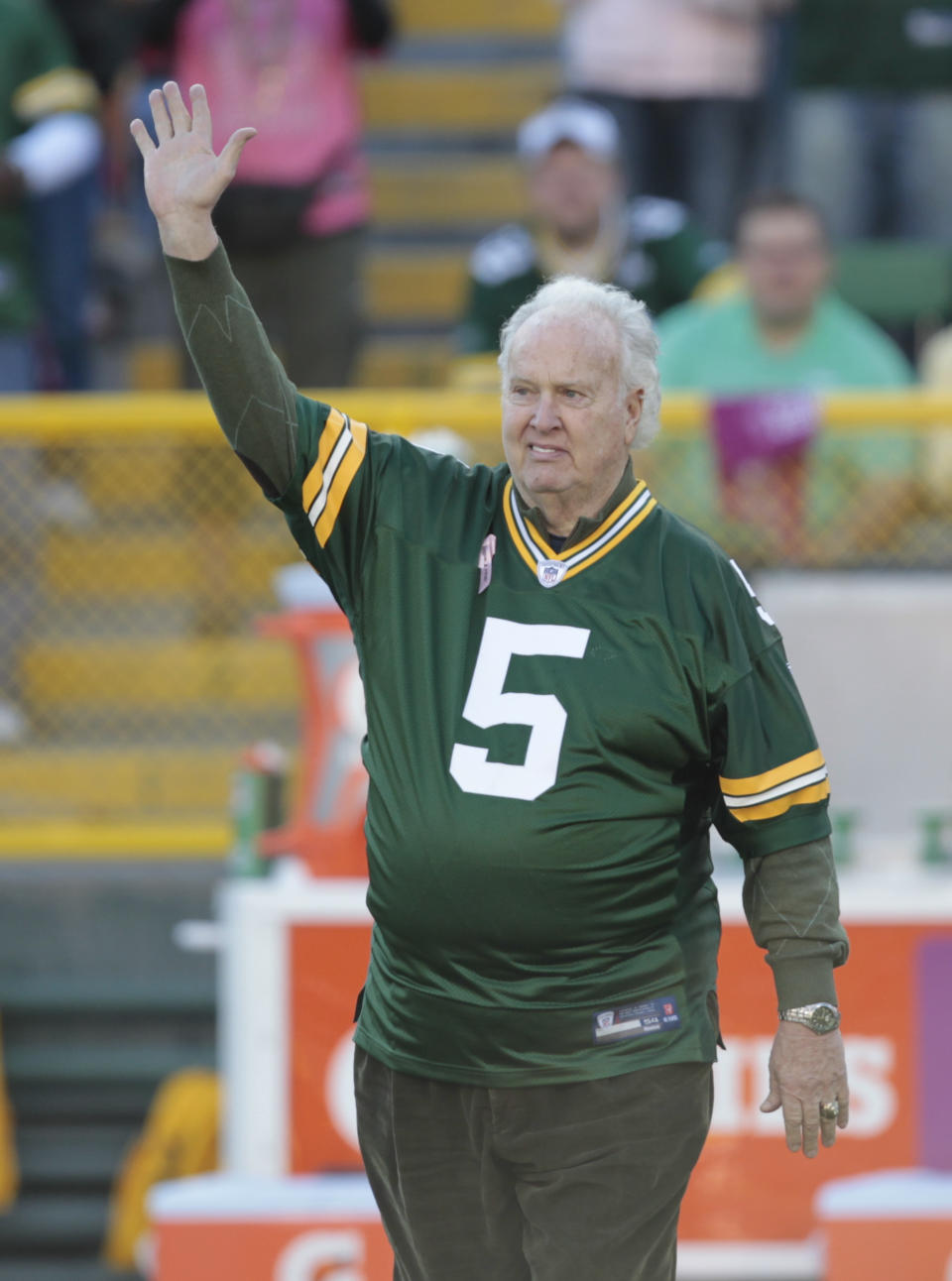 FILE - In this Oct. 2, 2011 file photo, former Green Bay Packer Paul Hornung waves to the crowd during an NFL football game in Green Bay, Wis. Hornung, the dazzling “Golden Boy” of the Green Bay Packers whose singular ability to generate points as a runner, receiver, quarterback, and kicker helped turn them into an NFL dynasty, has died, Friday, Nov. 13, 2020. He was 84. (AP Photo/Mike Roemer, File)