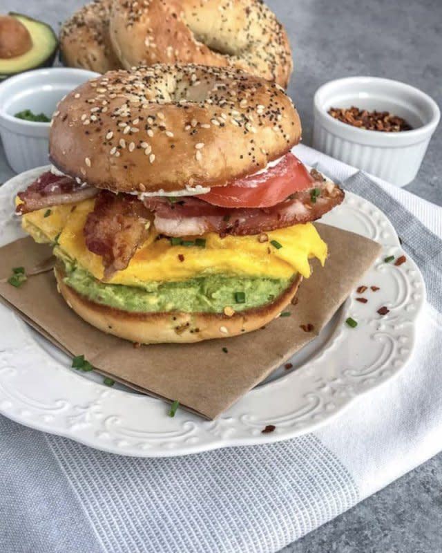 <p>WithPeanutButterOnTop.com</p><p>Fluffy, scrambled eggs, cream cheese, tomato slices, bacon and a garlic avocado mash.</p><p><strong>Get the recipe:</strong> <strong><a href="https://www.withpeanutbutterontop.com/bacon-egg-and-avocado-breakfast-bagel/" rel="nofollow noopener" target="_blank" data-ylk="slk:Bacon, Egg and Avocado Breakfast Bagel;elm:context_link;itc:0;sec:content-canvas" class="link ">Bacon, Egg and Avocado Breakfast Bagel</a></strong></p>