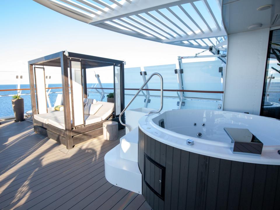 a cabana and hot tub on the balcony of the Iconic suite on the Celebrity Apex cruise ship