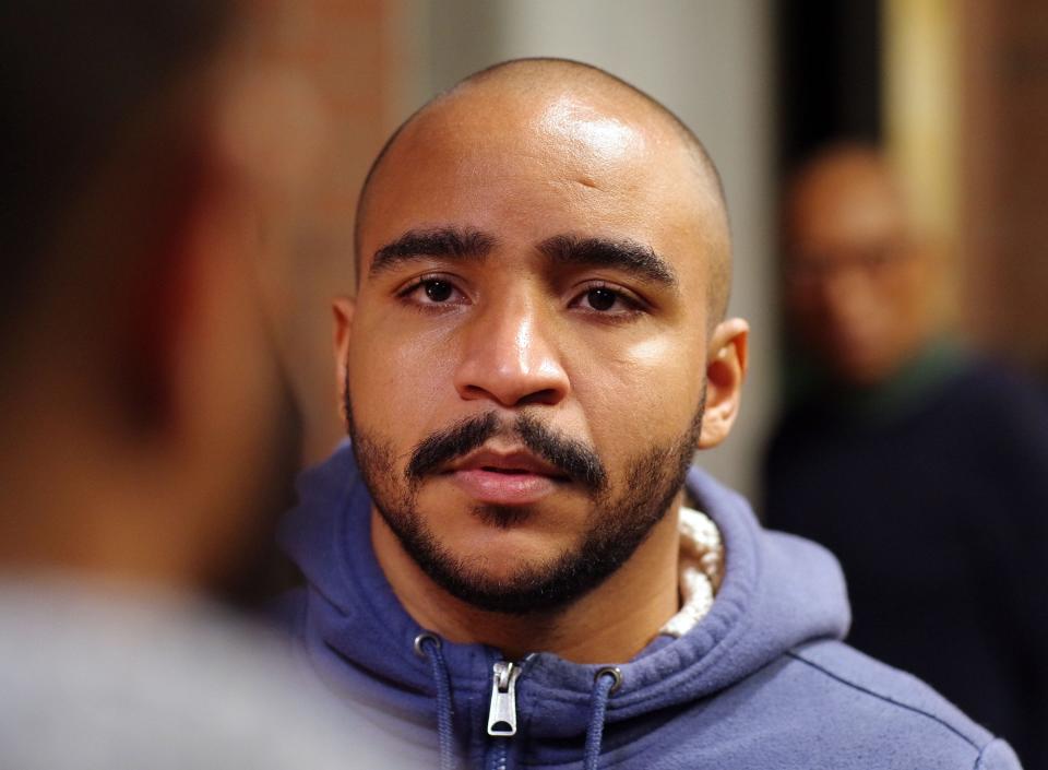 Zair Silva, center, co-director and co-producer of the play "Smoked Oysters," fine tunes a scene where a police officer, played by Edmar Goncalves, left, delivers the news to Silva's character that his mother was killed in a hit and run crash. The play was performed at Anawan Studios in downtown Brockton on Sunday, March 5, 2023.