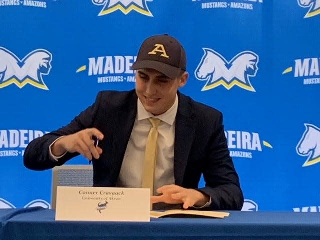 Conner Cravaack of Madeira signs his letter of intent to play football at the University of Akron.