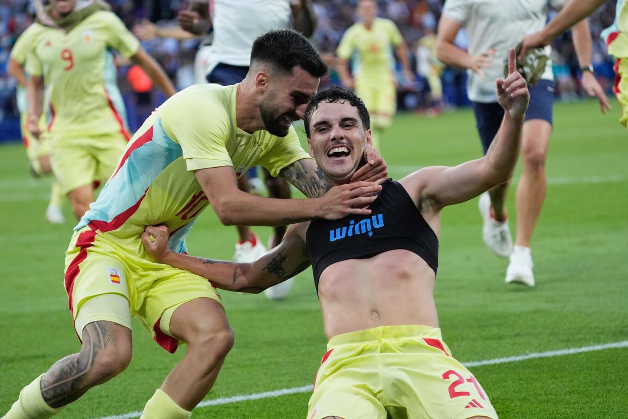 Spain fights off France in extra time for men's soccer gold