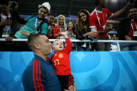 <p>Aspas of Spain speaks with his family during the warm up prior to the 2018 FIFA World Cup Russia group B match between Spain and Morocco at Kaliningrad Stadium on June 25, 2018 in Kaliningrad, Russia. (Photo by Jamie Squire – FIFA/FIFA via Getty Images) </p>