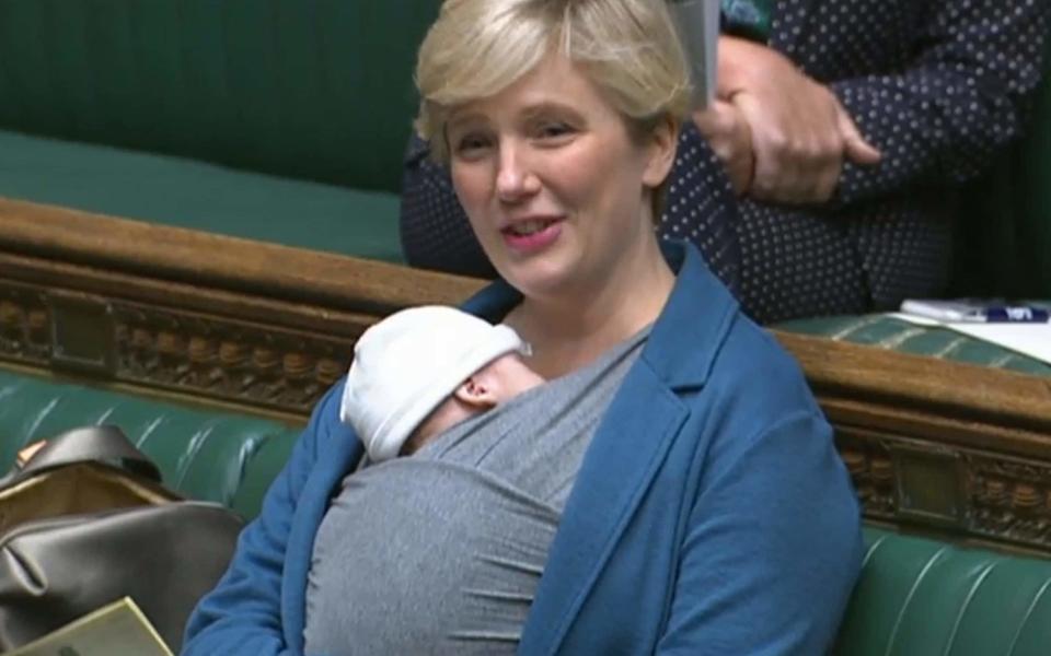 Stella Creasy and her newborn son strapped to her chest in the chamber - House of Commons/PA